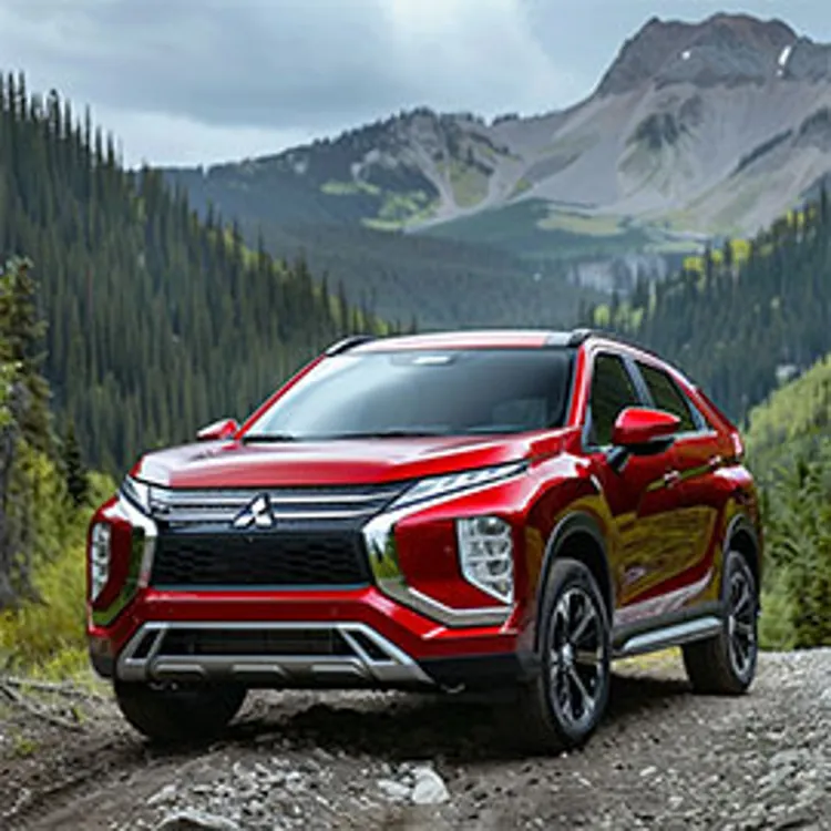 red mitsubishi suv parked in a mountainous area