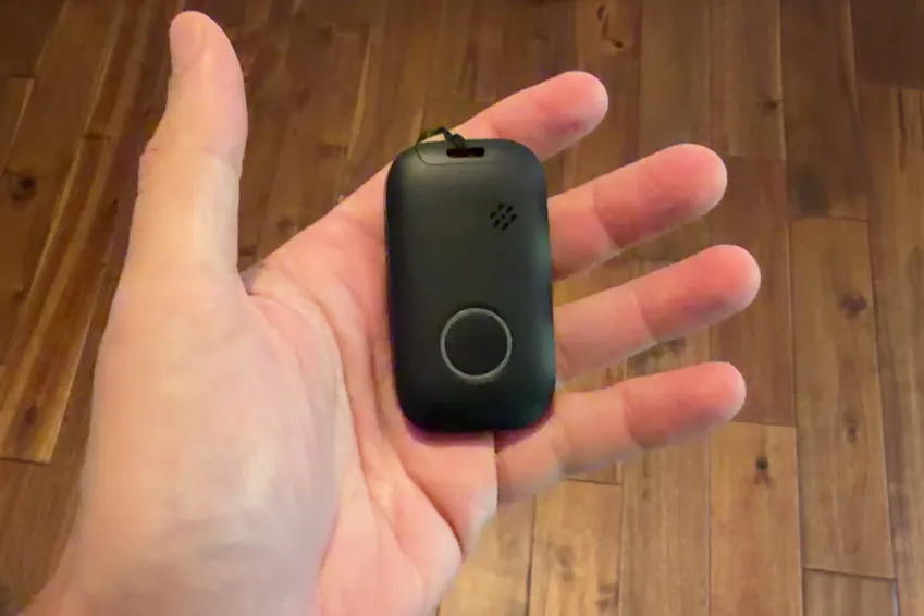 MobileHelp Elite pendant resting in an open palm