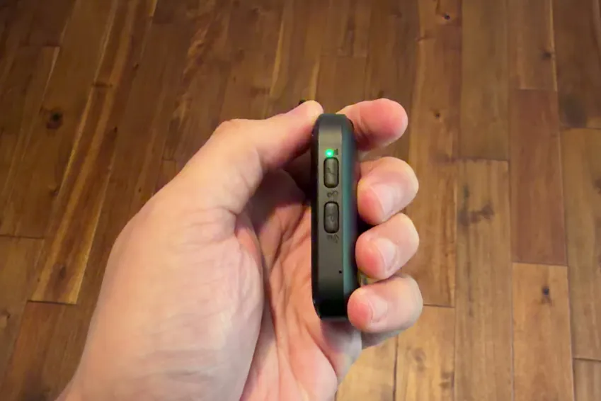 Side of the MobileHelp Elite pendant showing its buttons and status light