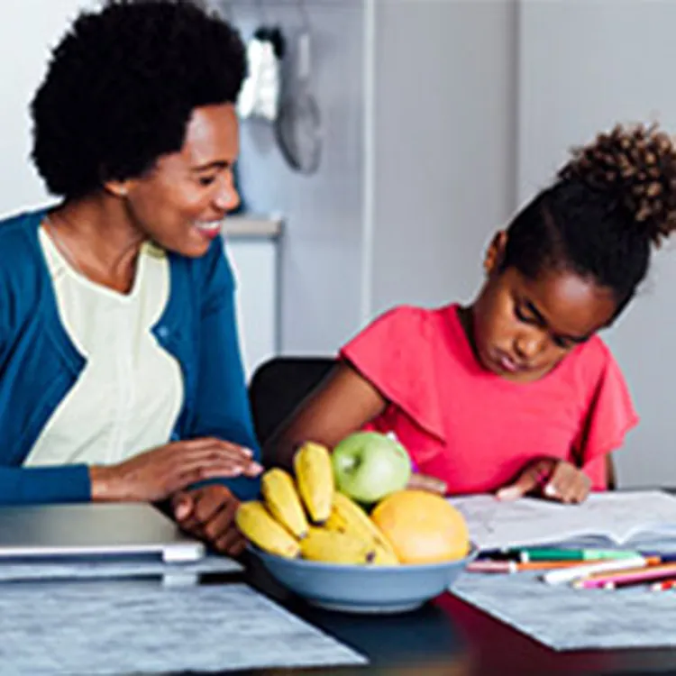 mother homeschooling daughter
