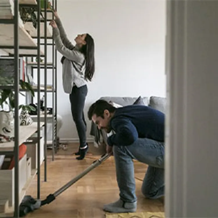 couple cleaning house before moving out