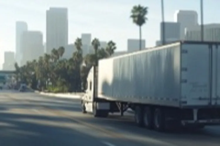 a moving truck on a highway in California