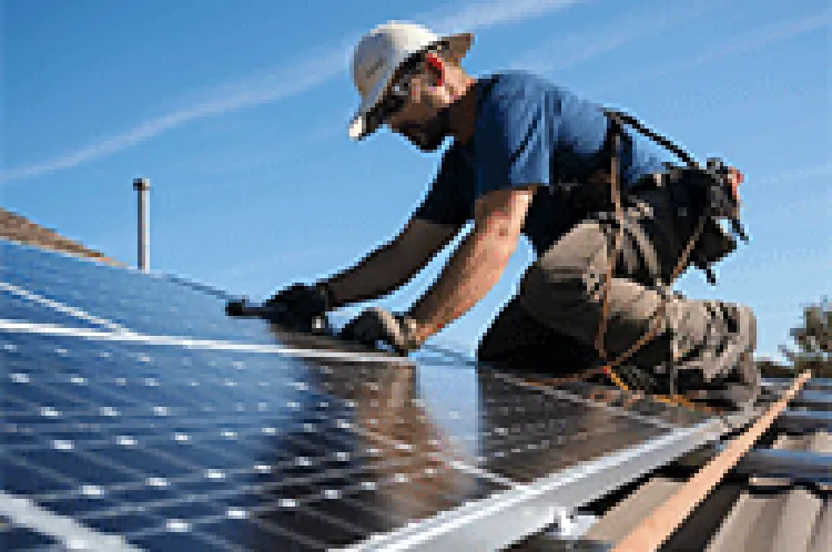 man installing solar panels