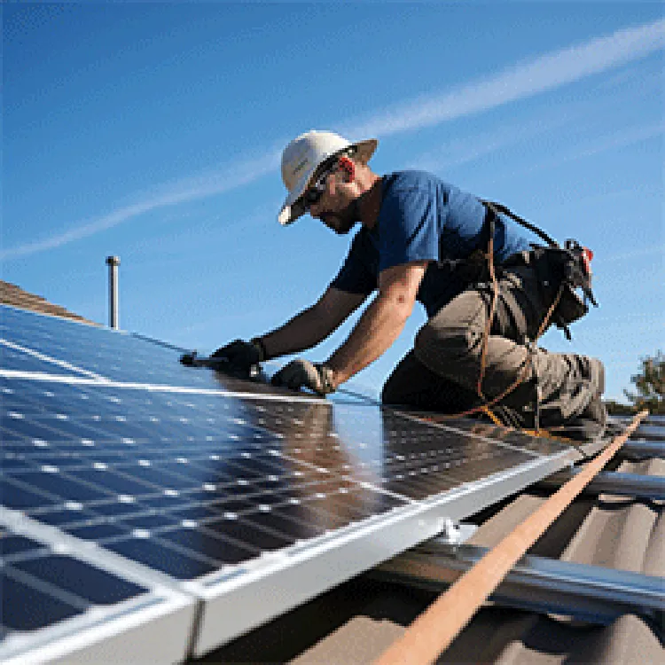 man installing solar panels