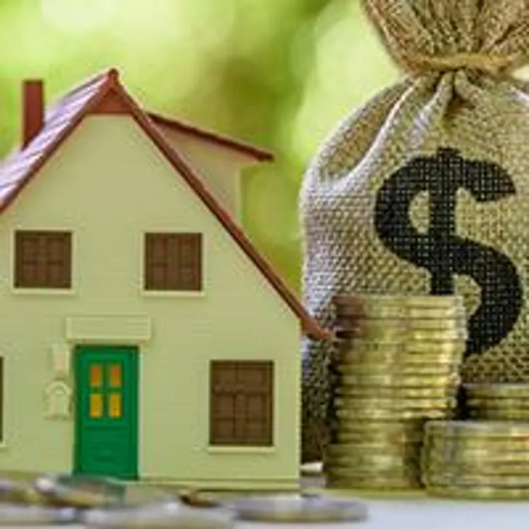 house with stack of coins