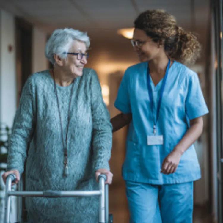 nurse helping woman with walker