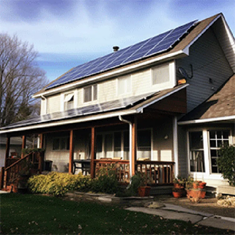 big house with solar panels on roof