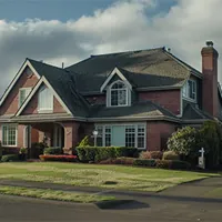 two-story brownstone home with a big lawn in front in oregon