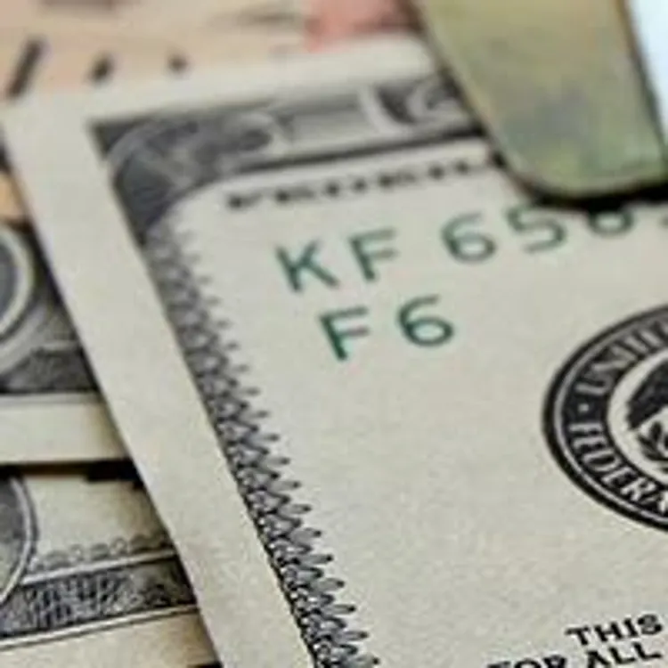 credit cards stacked on top of cash
