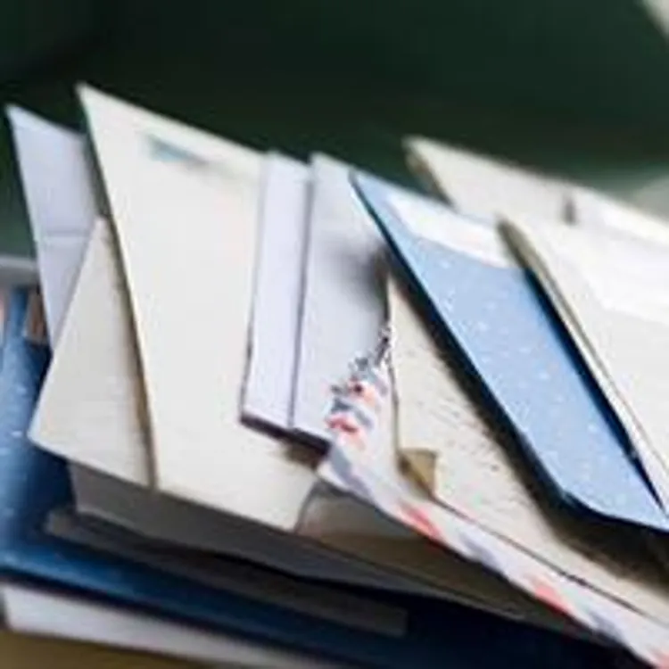 pile of mail on desk
