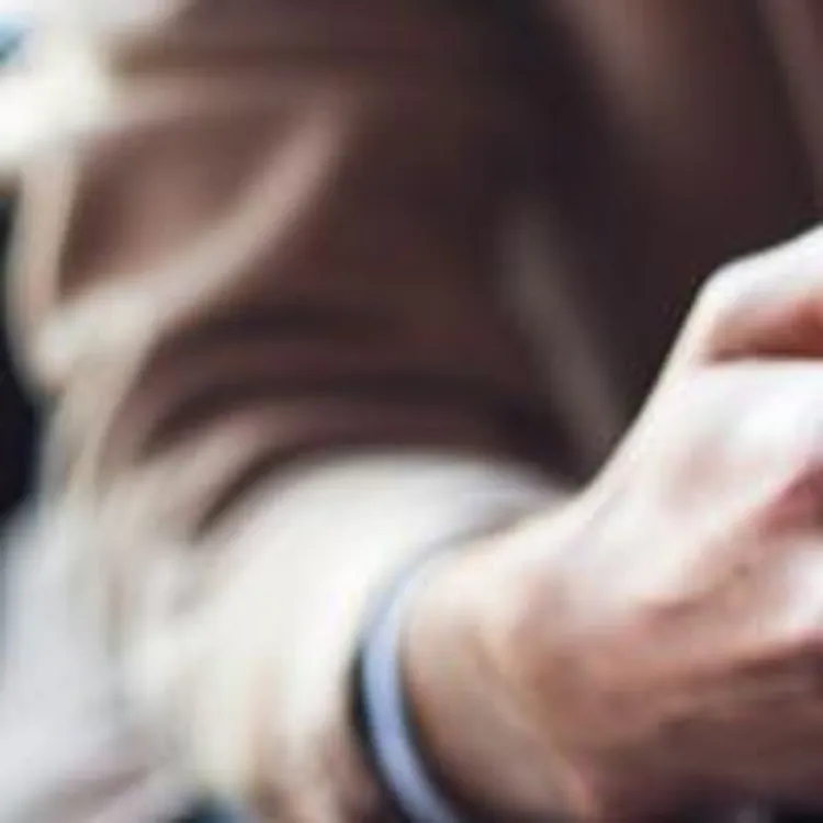 man holding phone and credit card