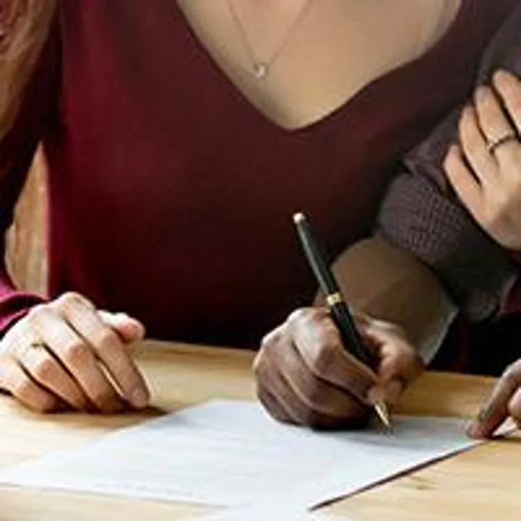 couple signing papers