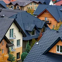 a view of houses with different roofing