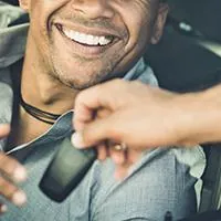 salesperson handing over car keys
