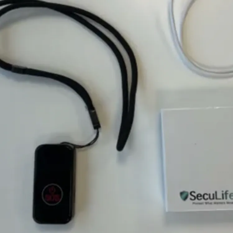 Medical alert device with lanyard, USB charging cable, and SecuLife product box on a white surface
