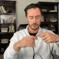Chris Kolmar pulling the SecuLife SOS lanyard over his head