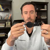 Chris Kolmar pulling the cord out of the SecuLife SOS retractable belt clip and letting it snap back