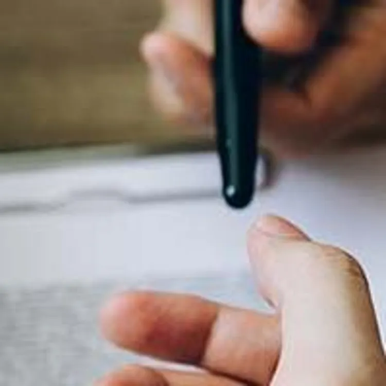 person handing over money and pen to someone