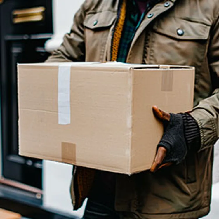 a man carrying a box