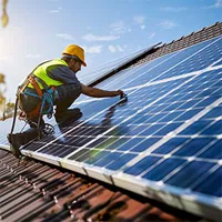 a solar technician installing solar panels on roof