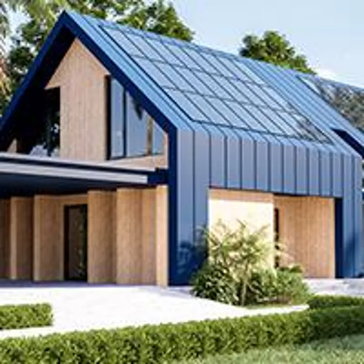 blue house with solar panels on the roof