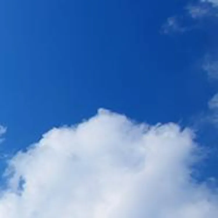 bright sun shining in the blue sky with white clouds