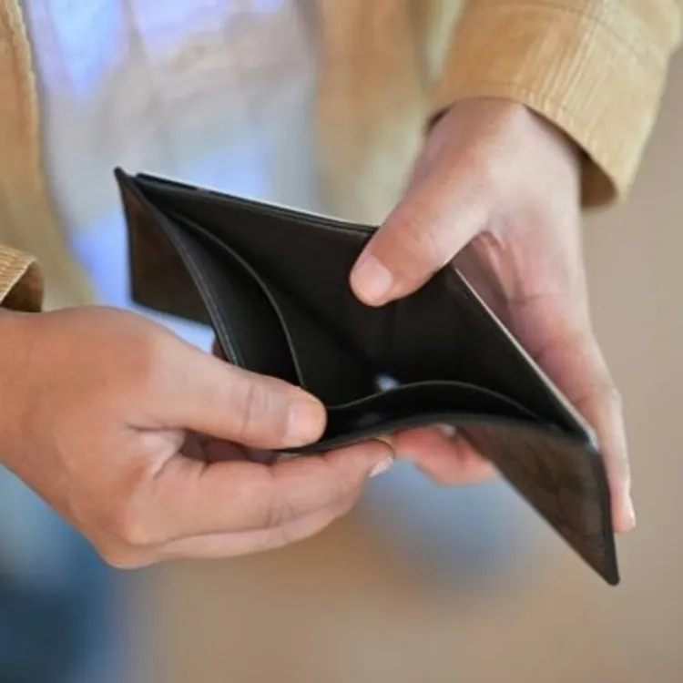 Person with calculator and receipts