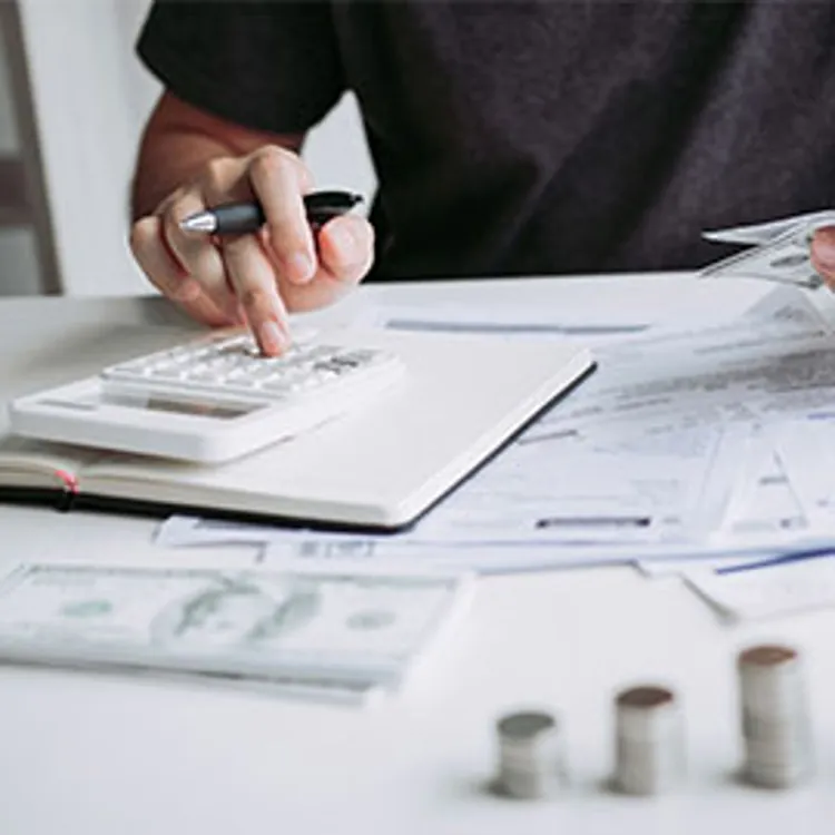 person calculating payments