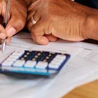 woman filling out tax paperwork