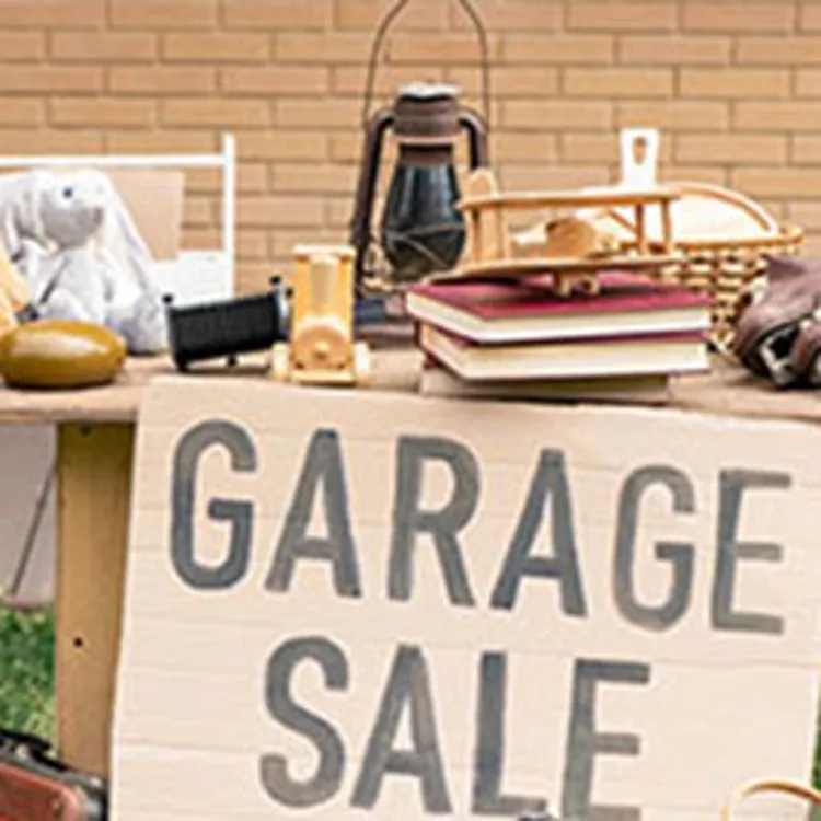 household and personal items for sale displayed outside home