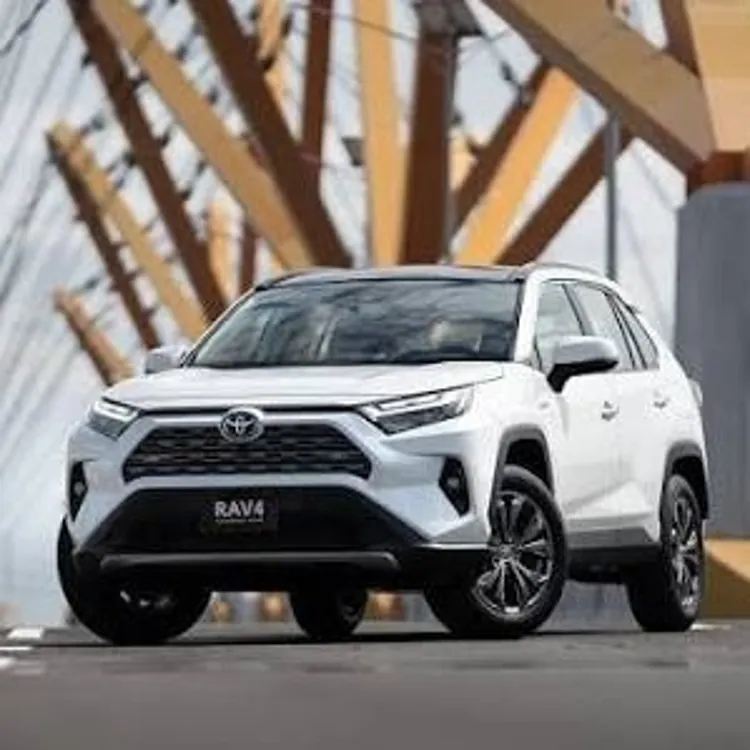 White SUV parked on a modern bridge with geometric support beams in the background
