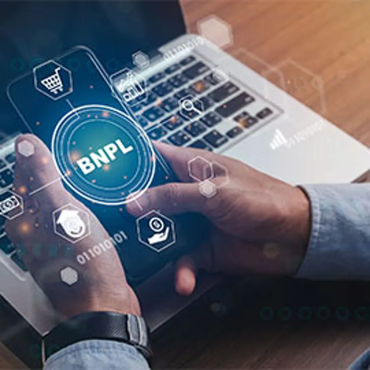 man holding smartphone with bnpl icon
