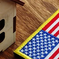 american flag patch with small house