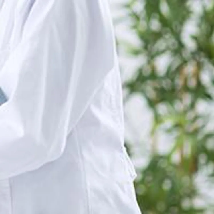 vet holding stethoscope against dogs chest
