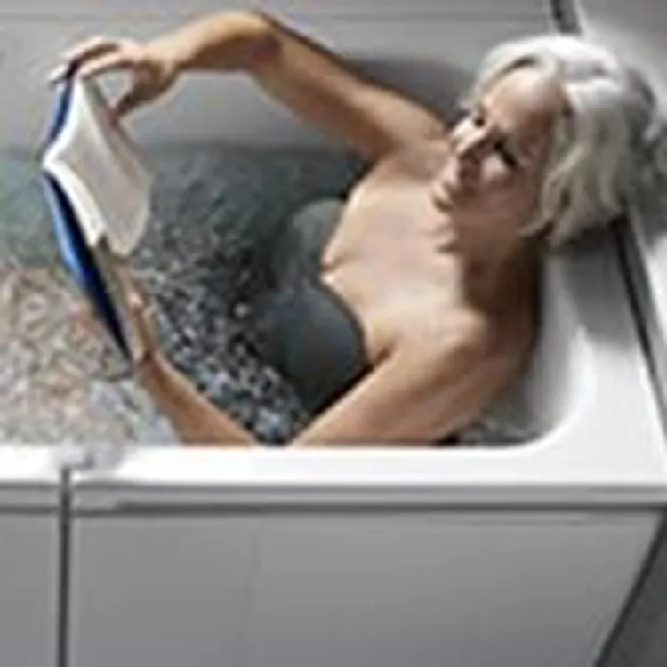 woman relaxing in her walk in bathtub