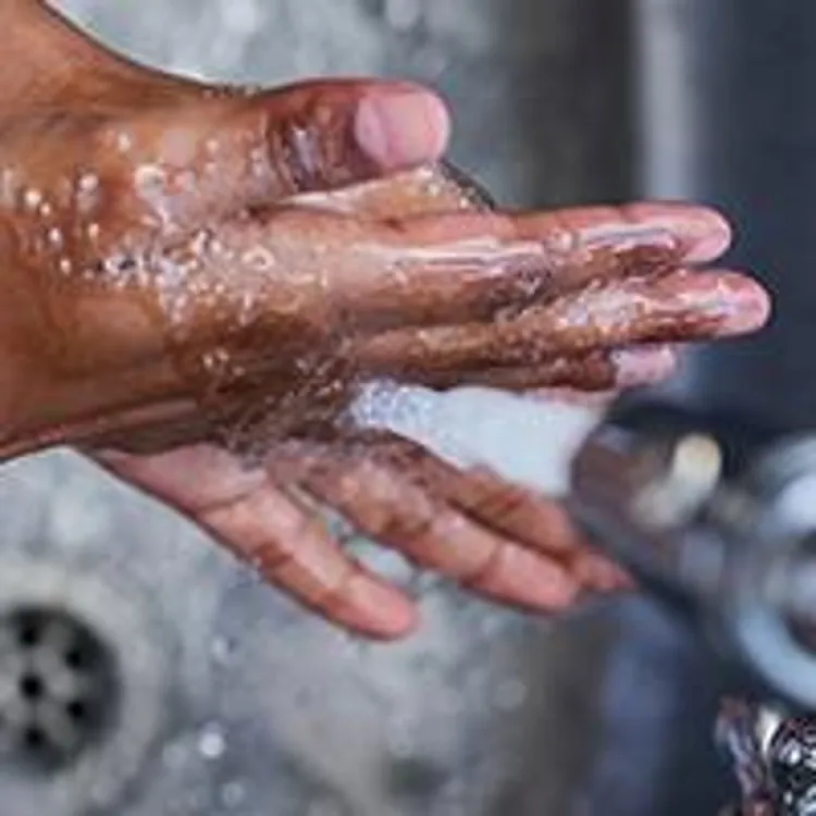 washing hands in sink