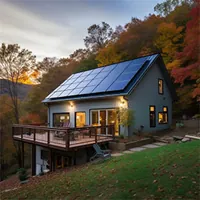 two story house built on uneven ground with solar panels on the roof
