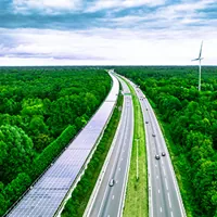 railway tunnel covered with solar panels next to a highway