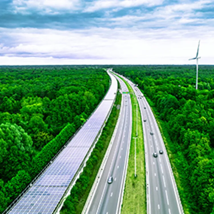 railway tunnel covered with solar panels next to a highway