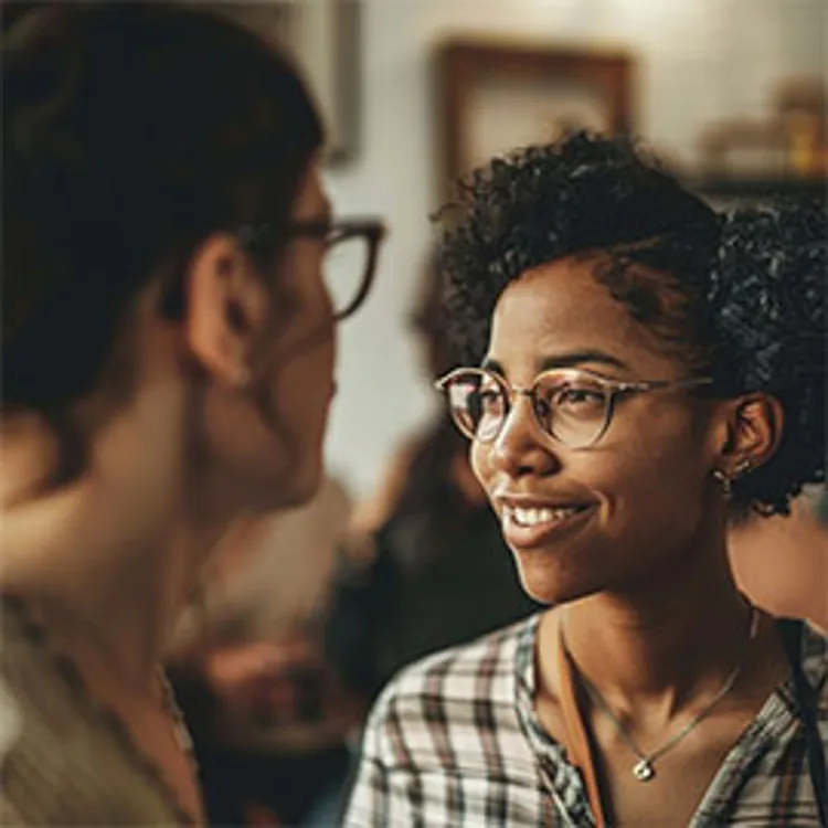 young woman talking to a young man