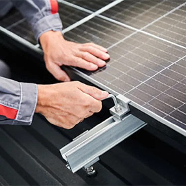 tech fixing solar panel onto roof