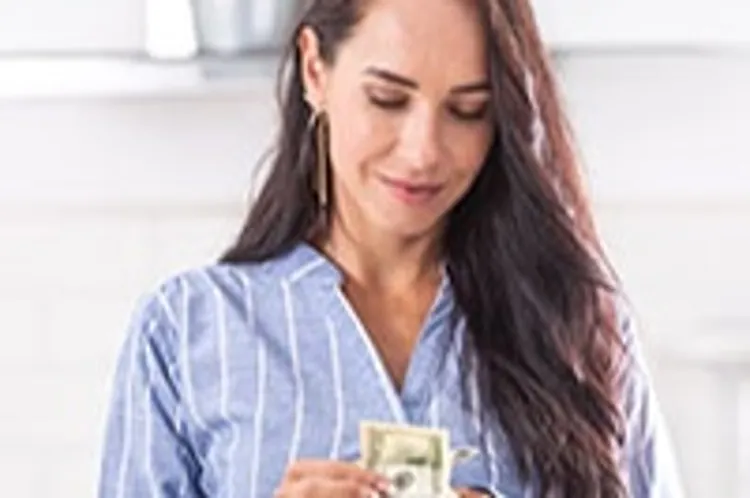 woman counting dollar bills