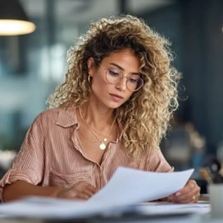 a woman reviewing some documents