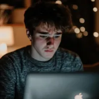 a man using a Macbook