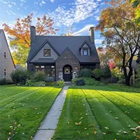 pathway with beautiful green lawn on both sides leading to a lovely home