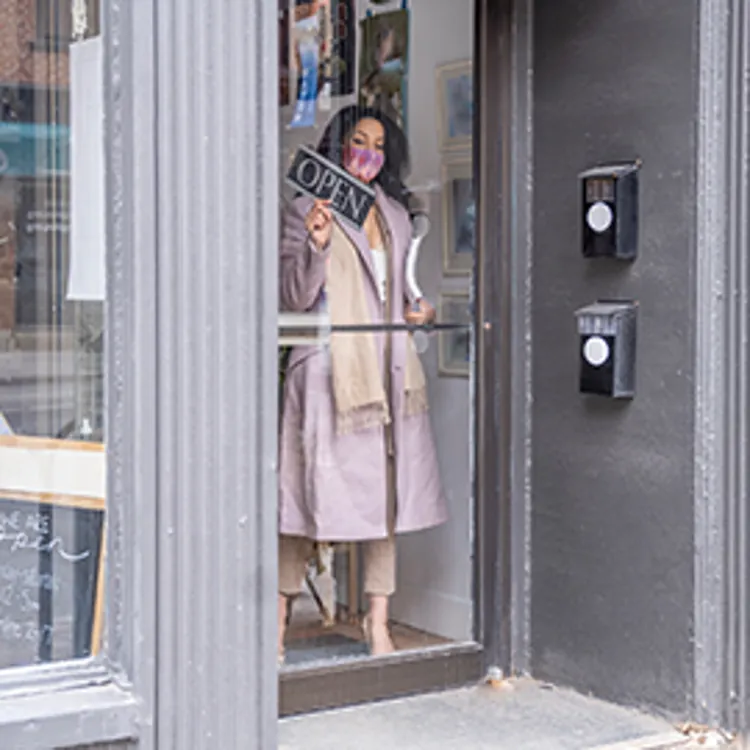 woman opening her small store