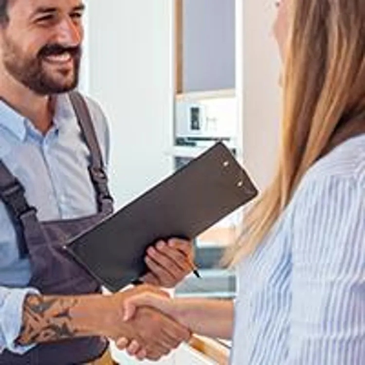 home appraiser shaking hands with homeowner