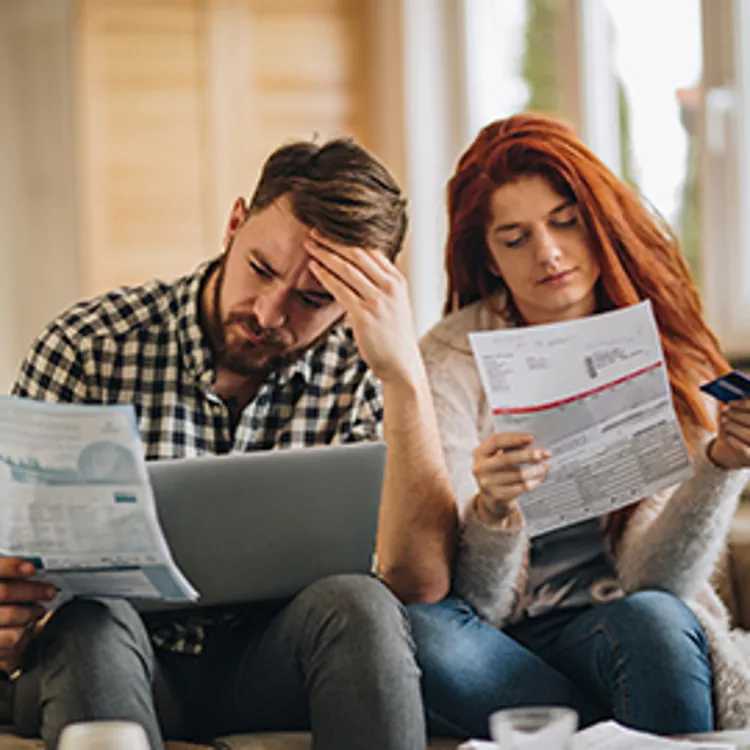 couple looking at bills