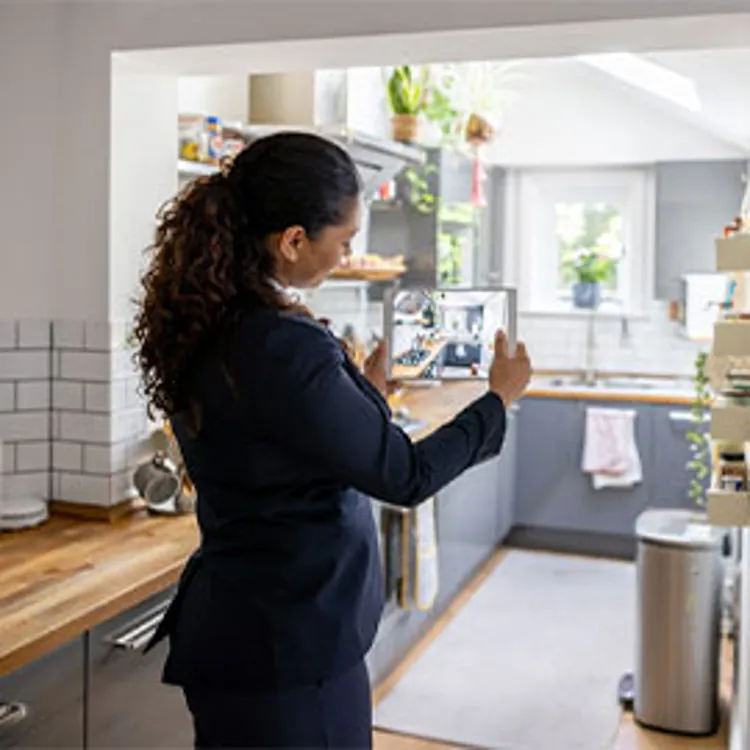 listing agent taking video of house for sale