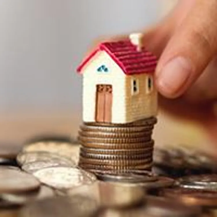 houses sitting on top of coins